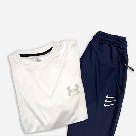 white round neck t shirt with under armor logo and navy blue trouser with zipper pockets having nike logo on it.