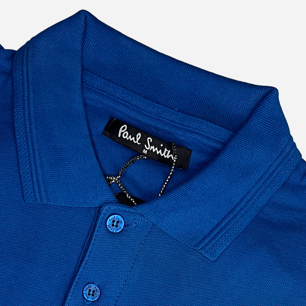 a closeup of catchy blue color paul smith polo shirts premium quality collar and front buttons