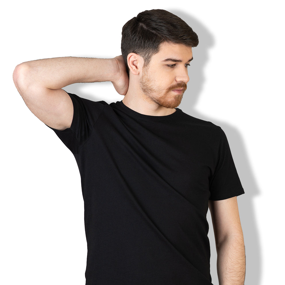 man holding his right hand on the back of his tilted head wearing black round neck half sleeves t shirt